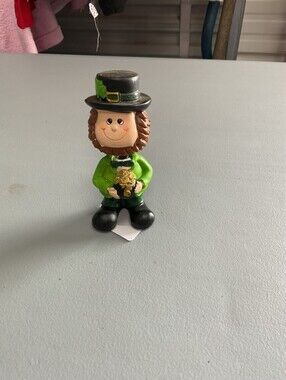Ceramic Leprechaun Figurine in Green Outfit Holding Gold Pot